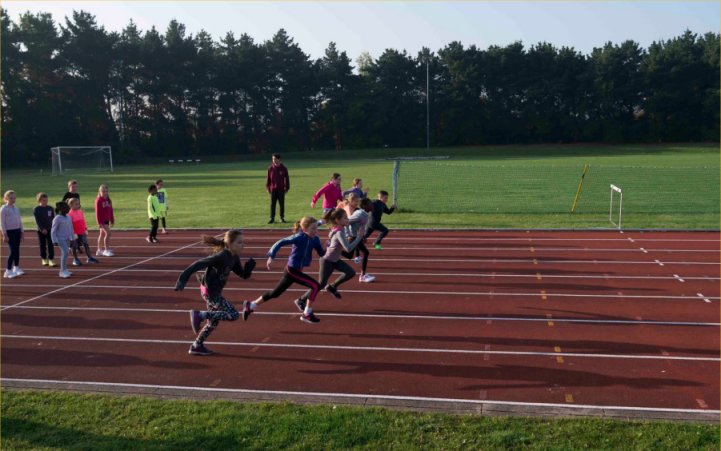 Young athletes sprinting